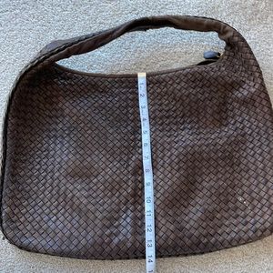 Brown over the shoulder Bottega bag.